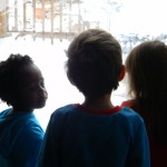 The cousins checking out the Christmas snow at their abuelos' house.